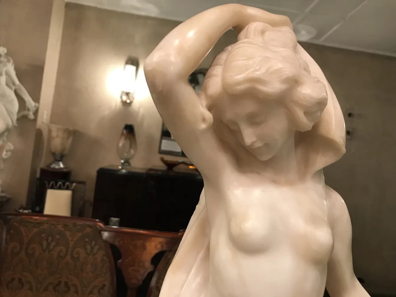 Antique sculpture with delicate details, elegant background