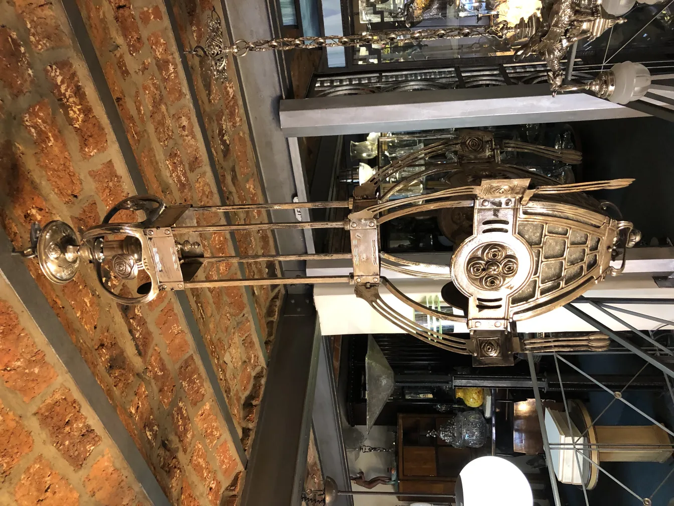 hanging antique lantern with decorative details in a rustic setting