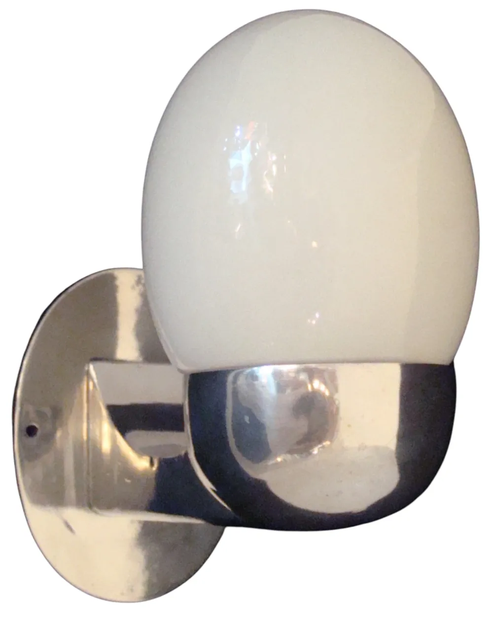 Antique pair of sconces with an oval shape and shiny base, elegant ambiance.