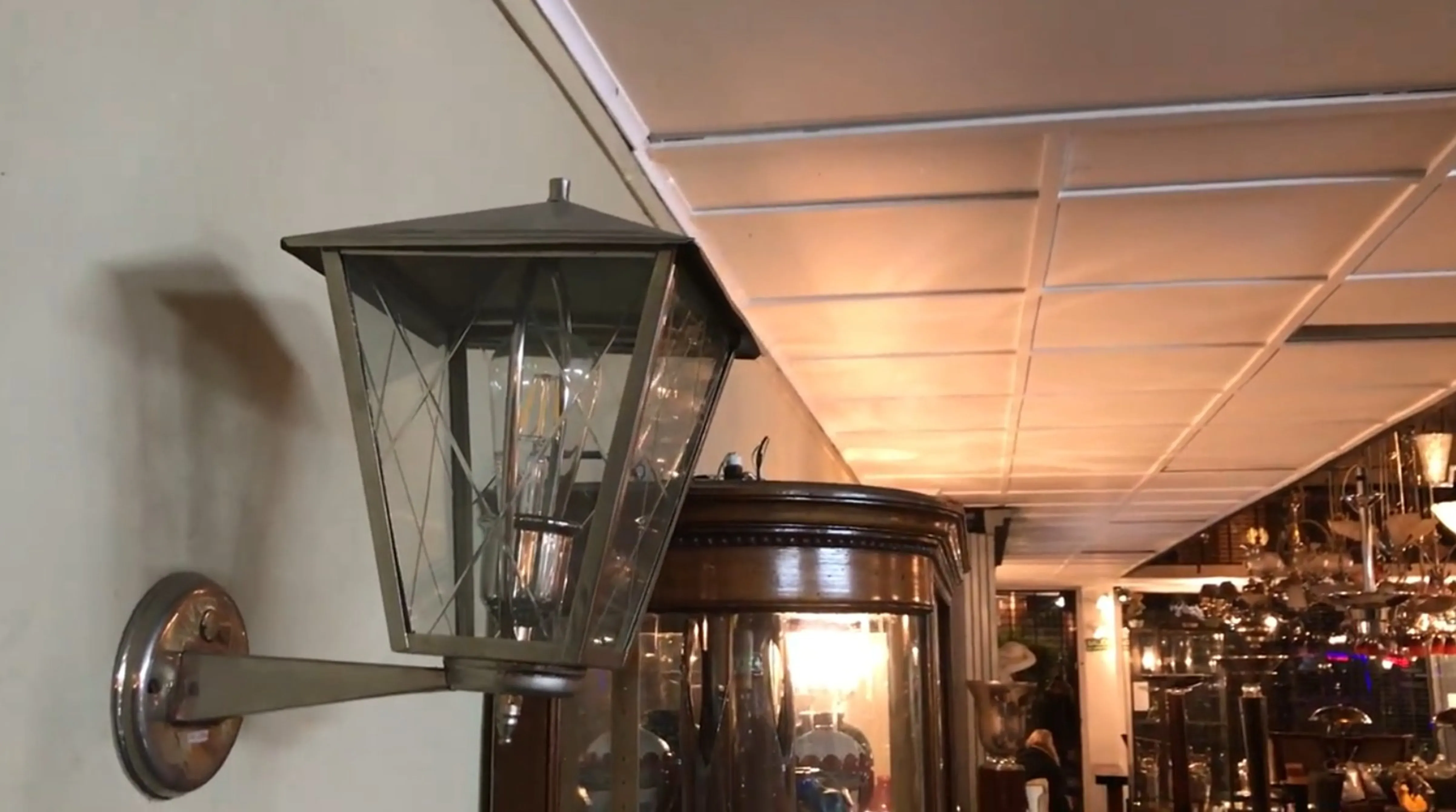 Pair of antique sconces in a warm, decorative environment, illuminating.