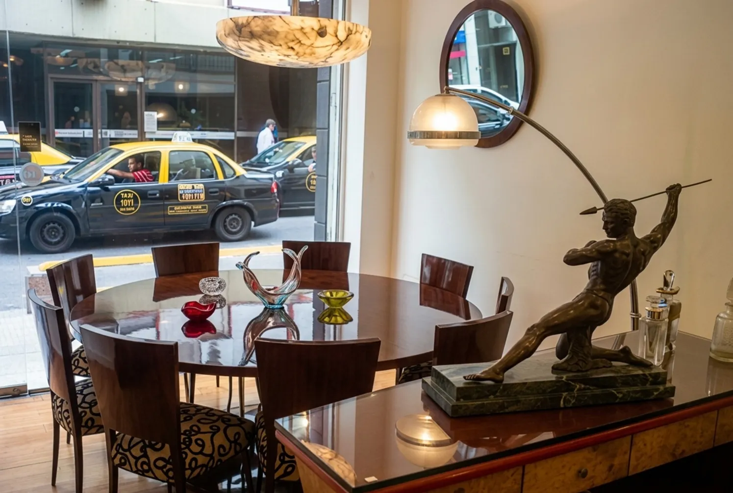 Antique floor lamp in Art Deco style, elegant and decorative, in a cozy setting with a modern table.