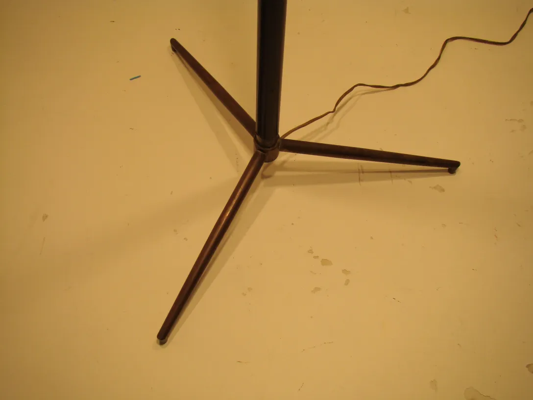 Antique floor lamp in Art Deco style with tripod base.