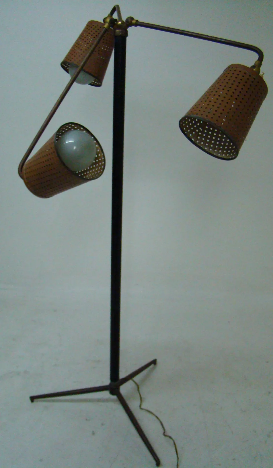 antique floor lamp with two shades in neutral setting