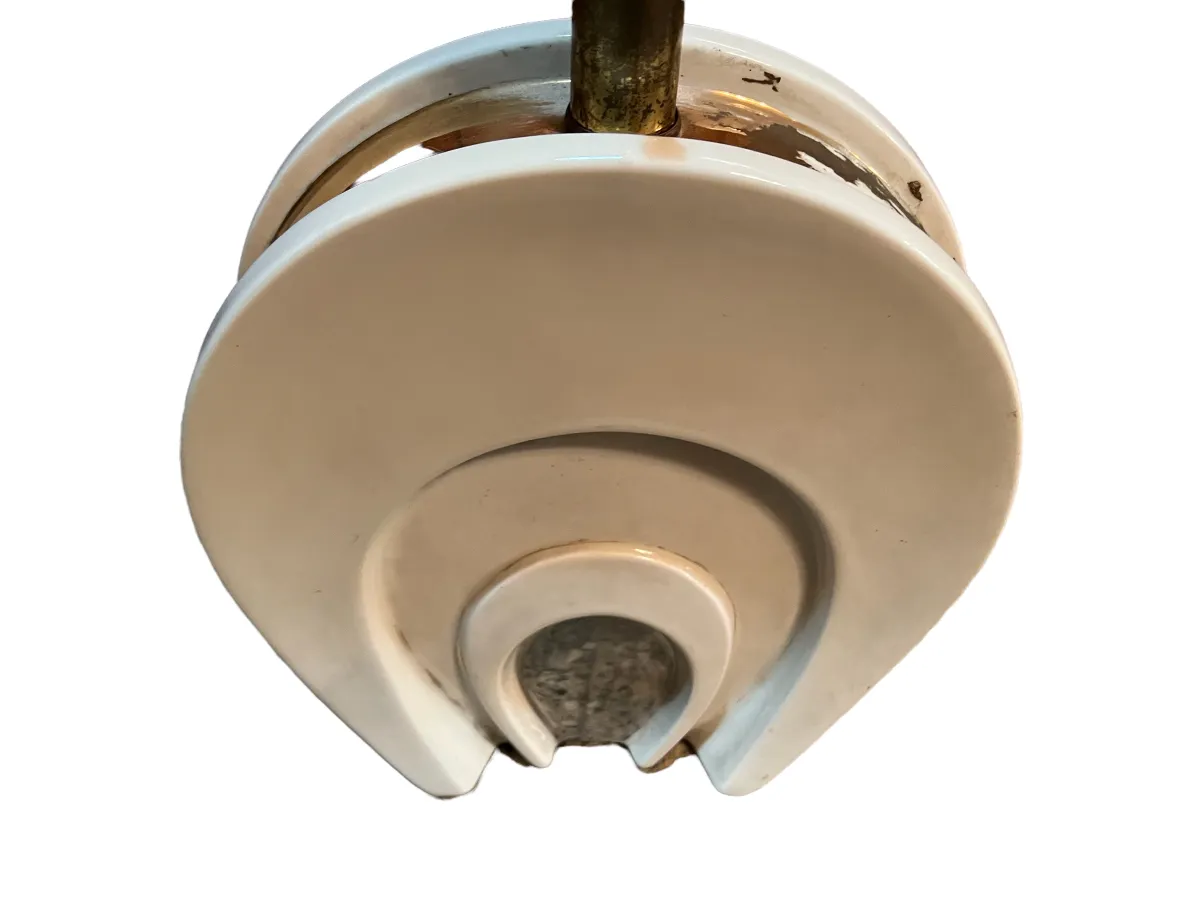 Antique table lamp Art Deco with circular shape, warm light in a cozy environment.