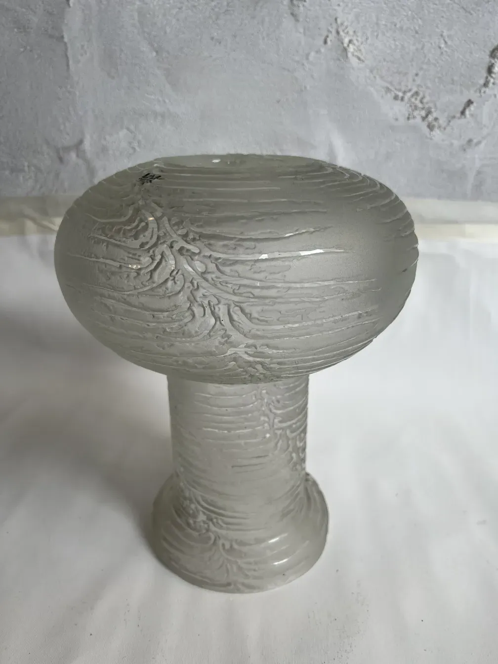 Antique table lamp in Art Deco style, featuring elegant design and subtle details, set in a cozy environment.