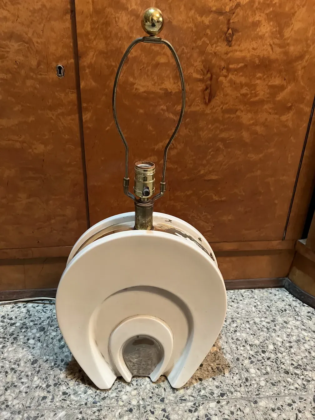 Antique table lamp in Art Deco style, providing a warm ambiance.