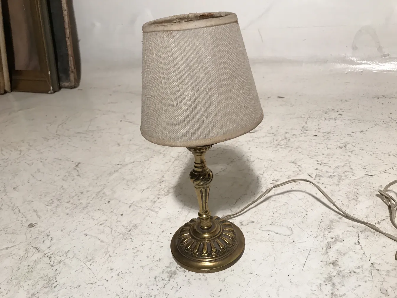 Antique table lamp in art deco style in a simple room.