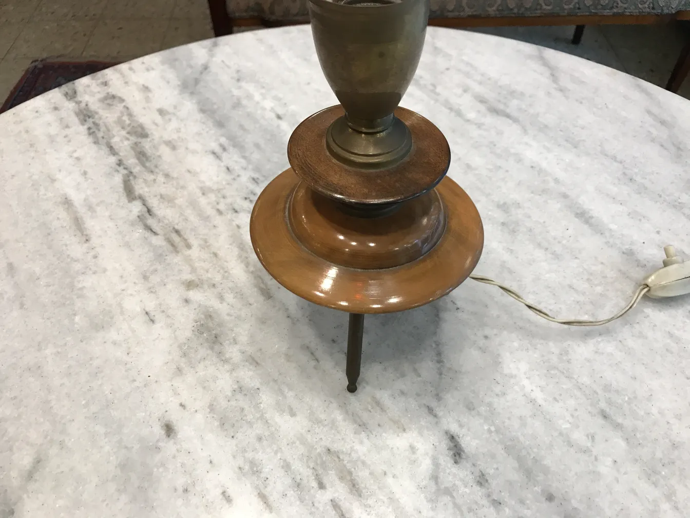 Antique table lamp in Art Deco style on a marble table
