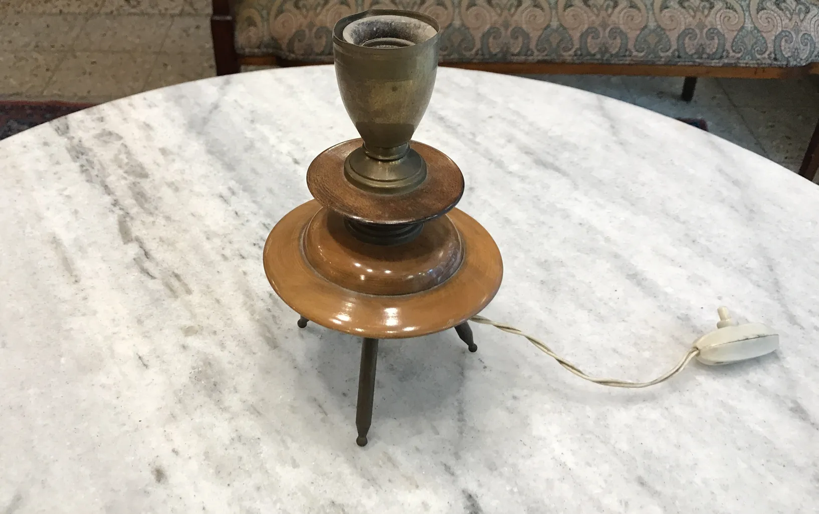 antique art deco table lamp with bronze details, rounded design, and elegant base