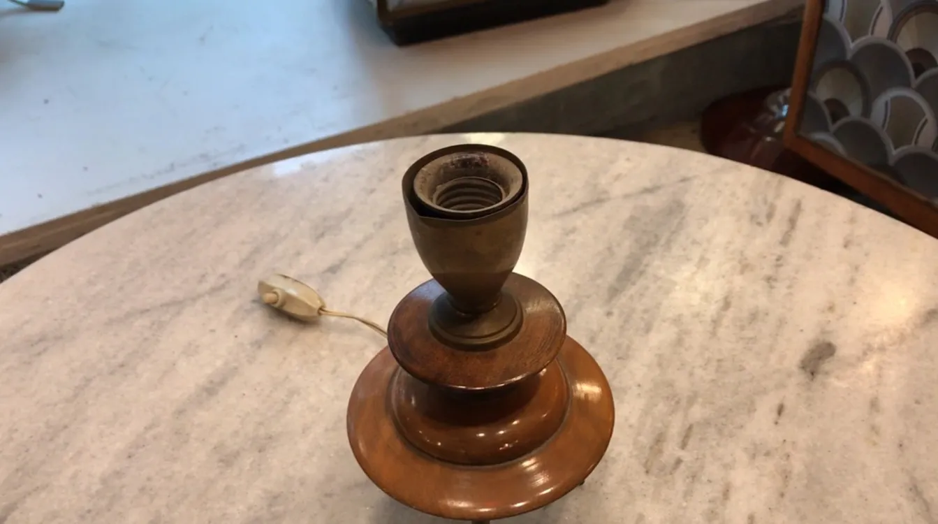 Antique table lamp in Art Deco style, decorative details on a marble table