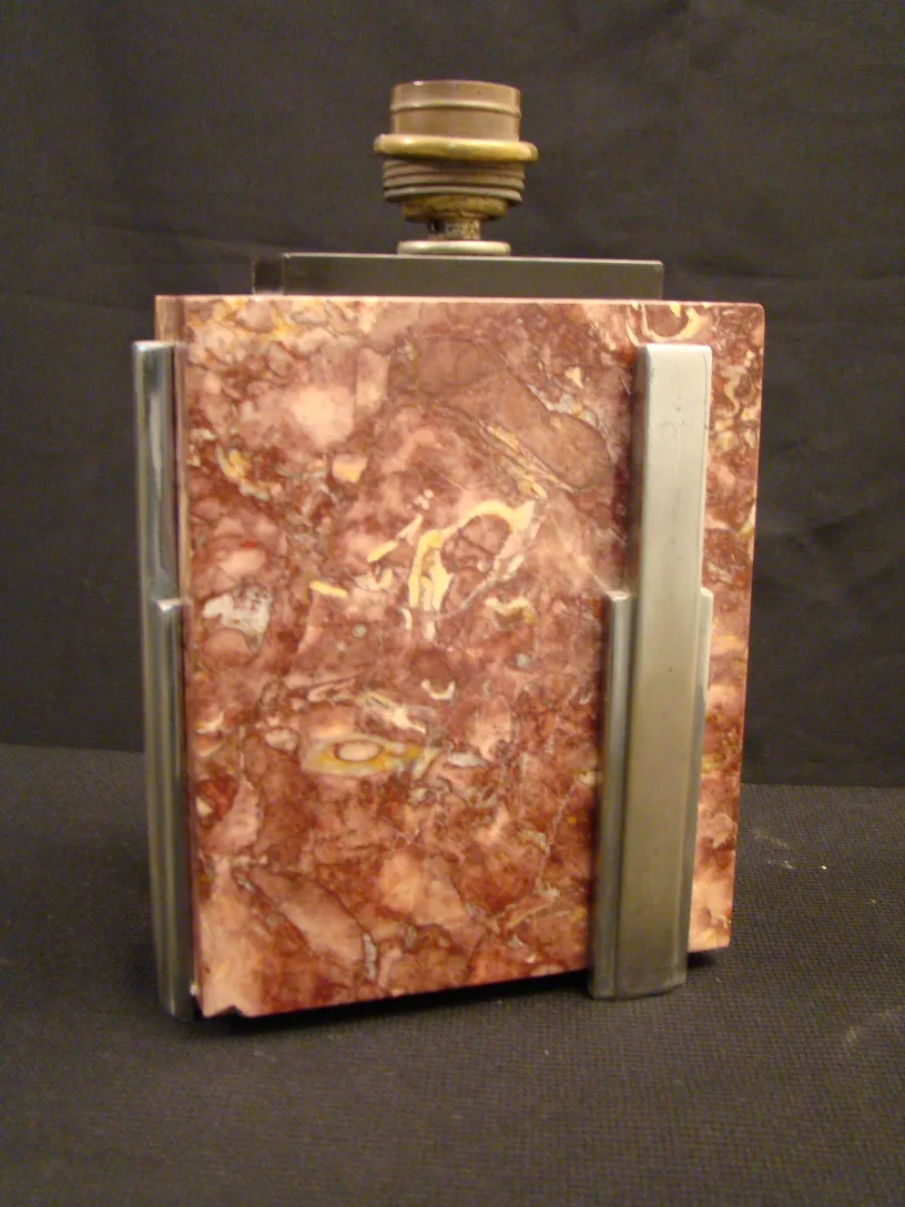 vintage table lamp with art deco design and metal base in an elegant setting