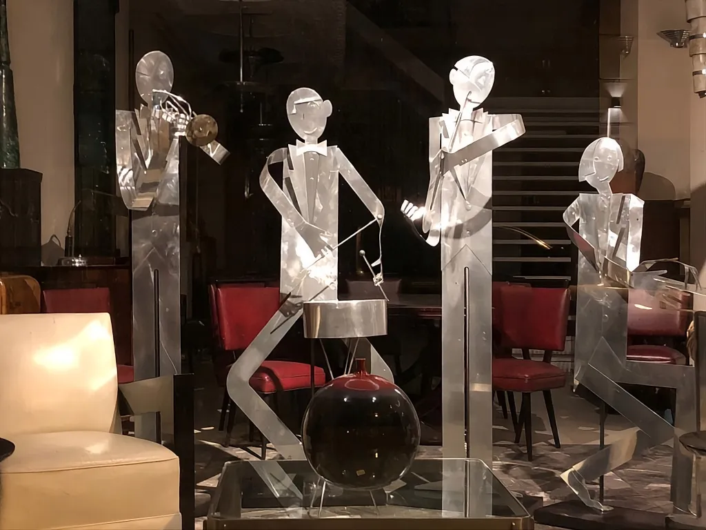 sculptures of a music band by designer marcelo pena in an antique setting