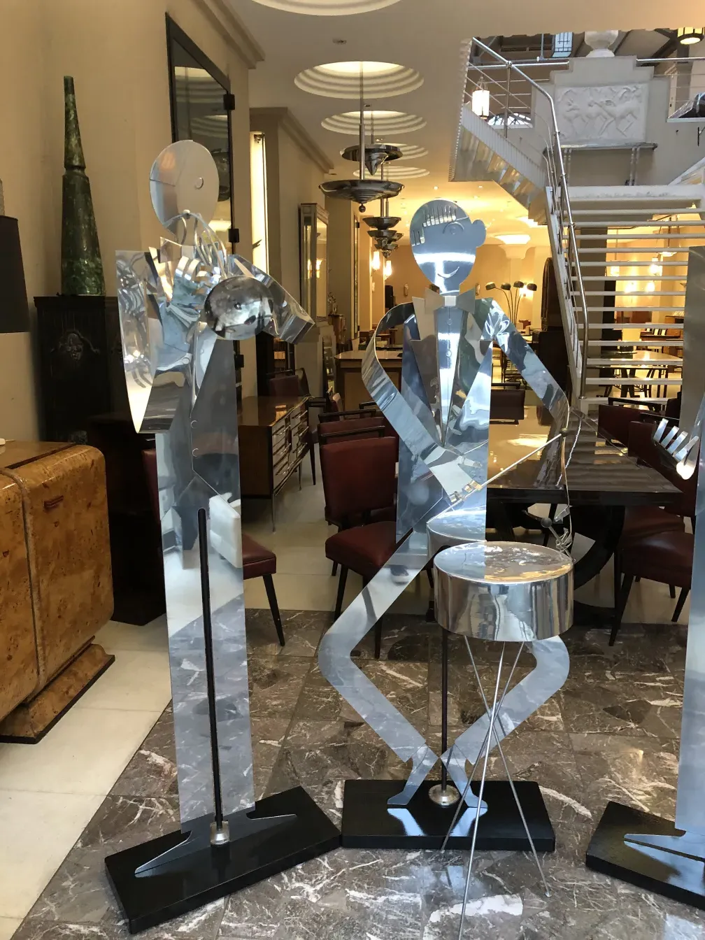 antique music band sculptures by designer marcelo pena in an indoor setting