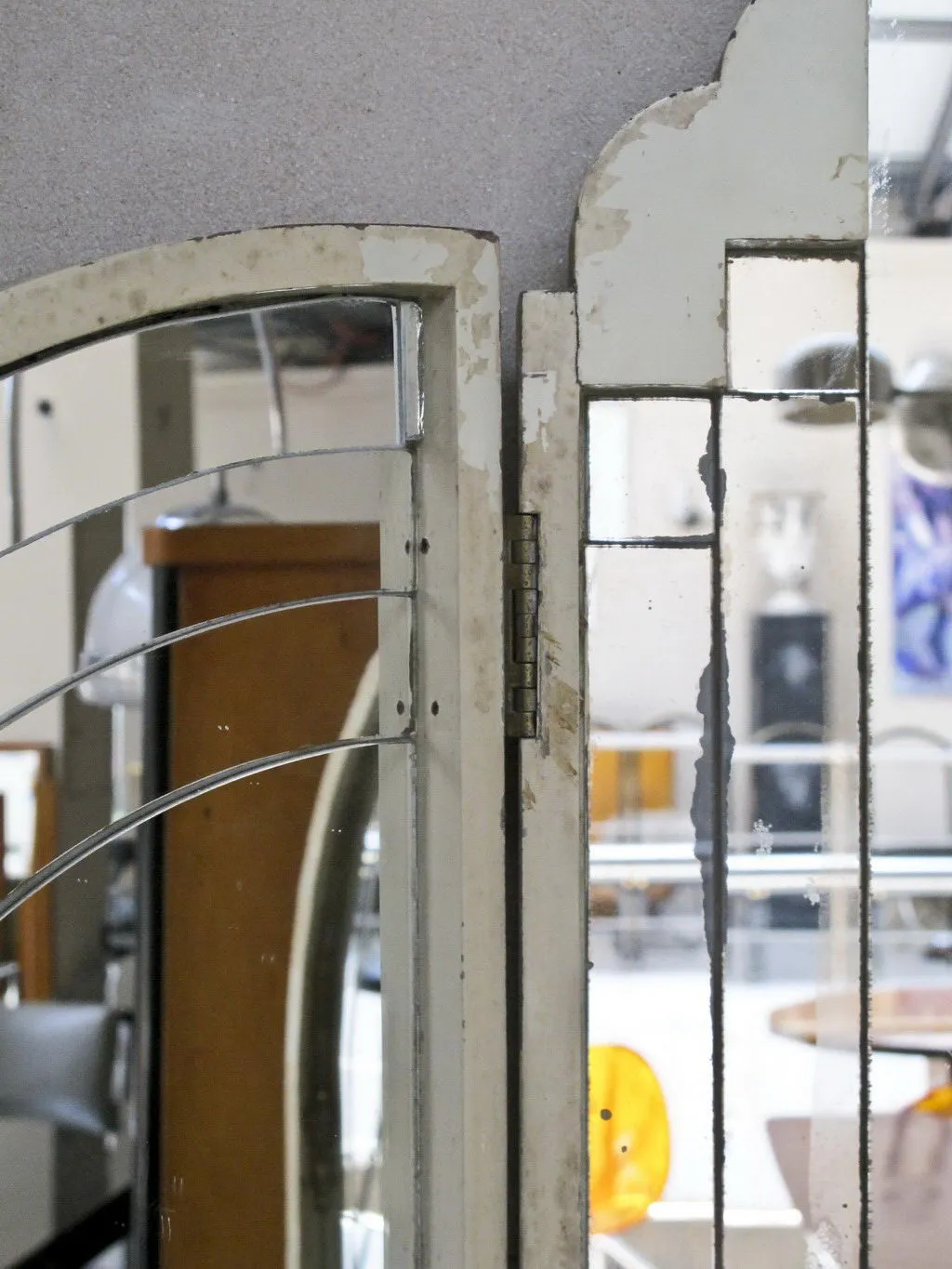 Antique art deco mirror in an elegant setting.