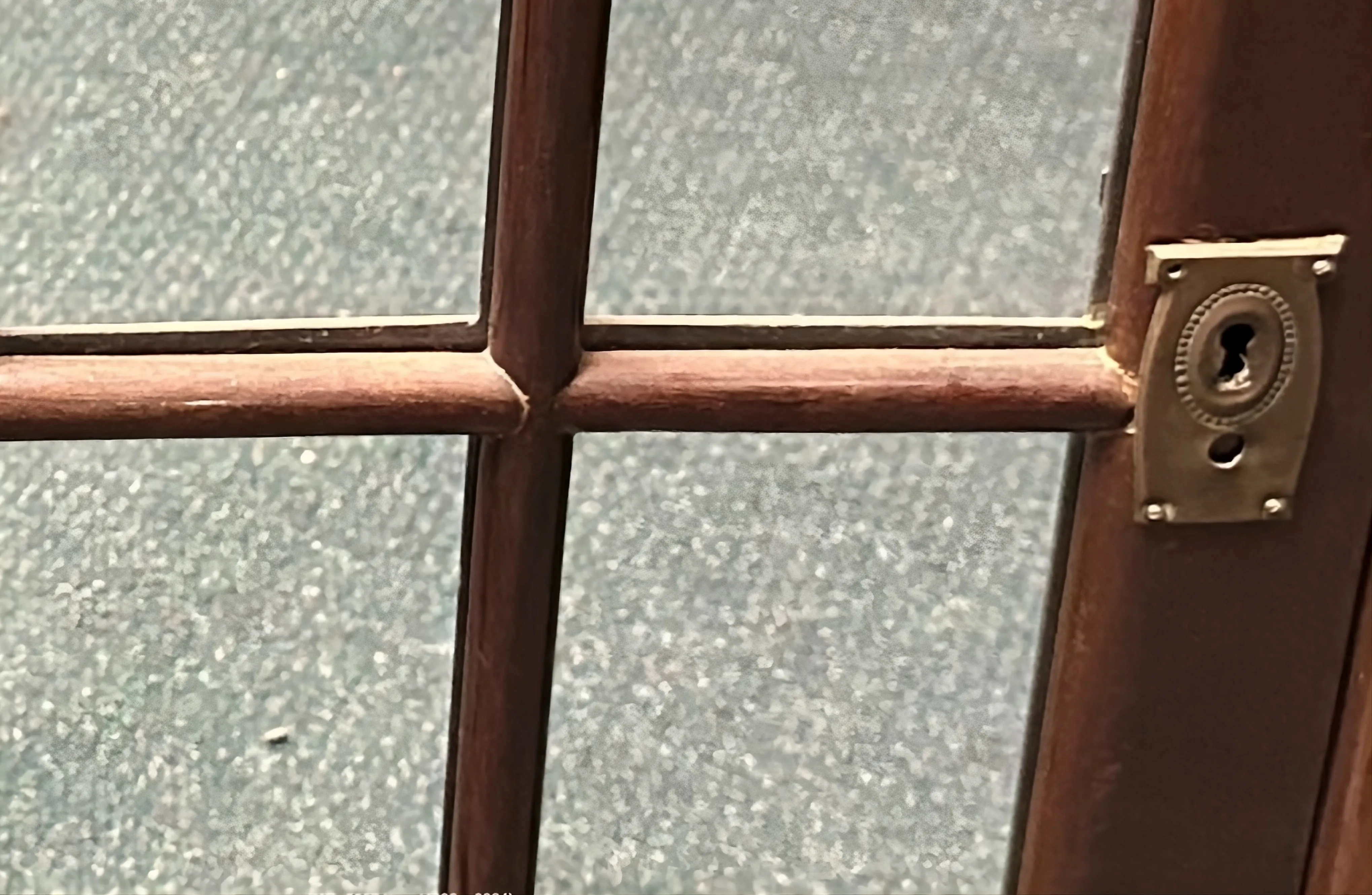 antique bedside table with decorative features and keyhole