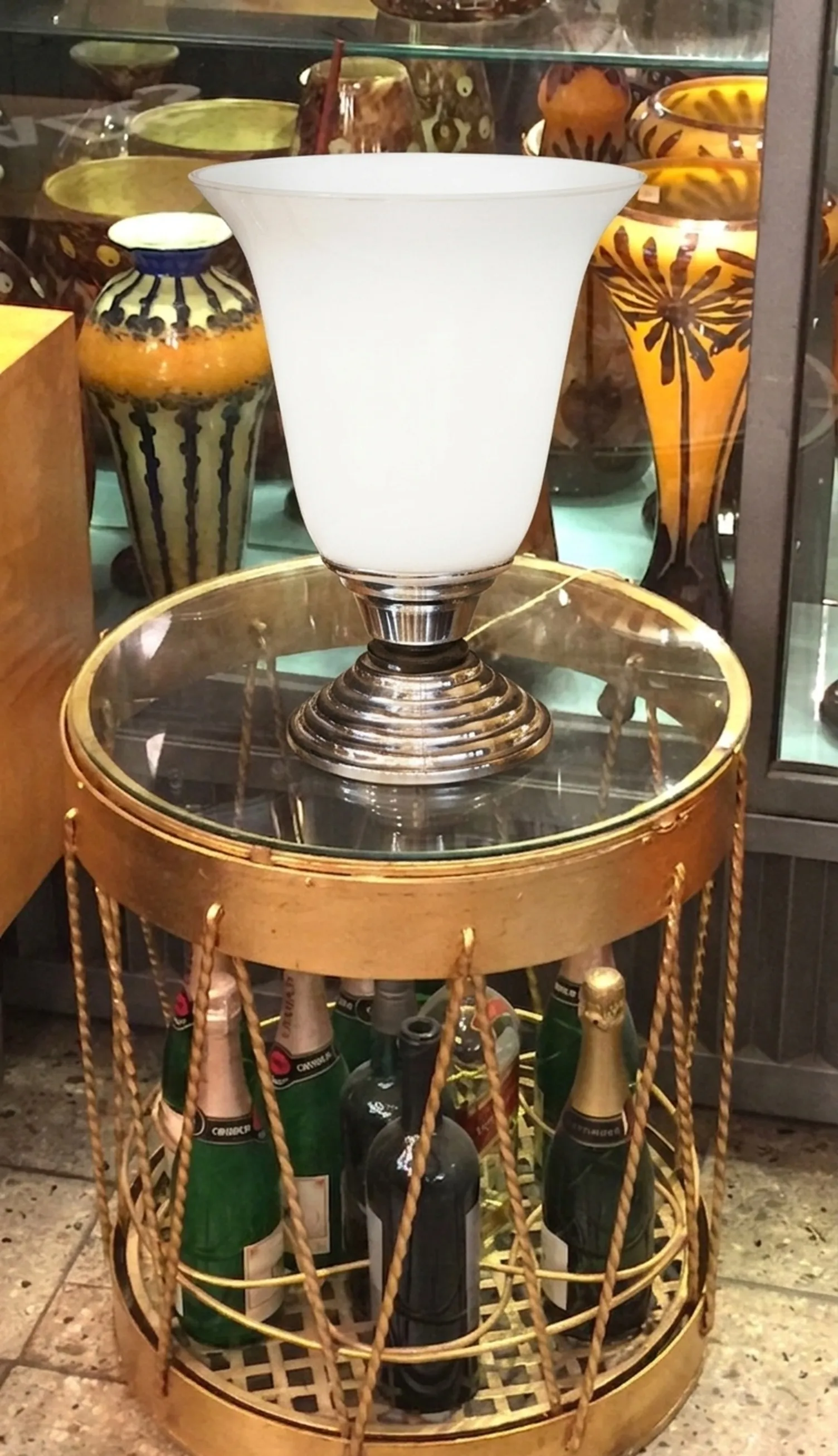 Antique table lamp with silver base and glass design.