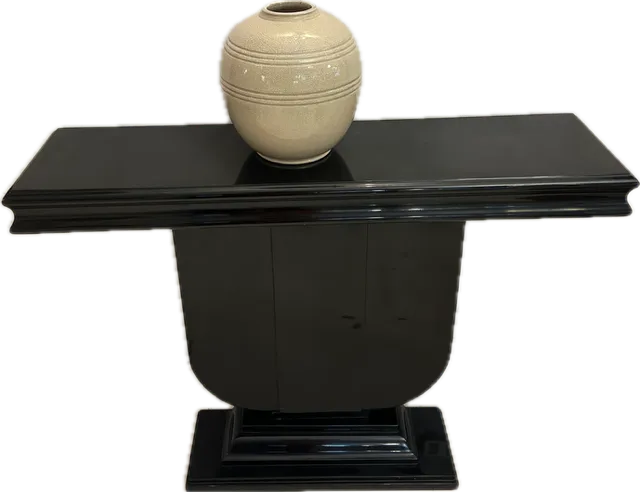 two antique consoles with a vase on top