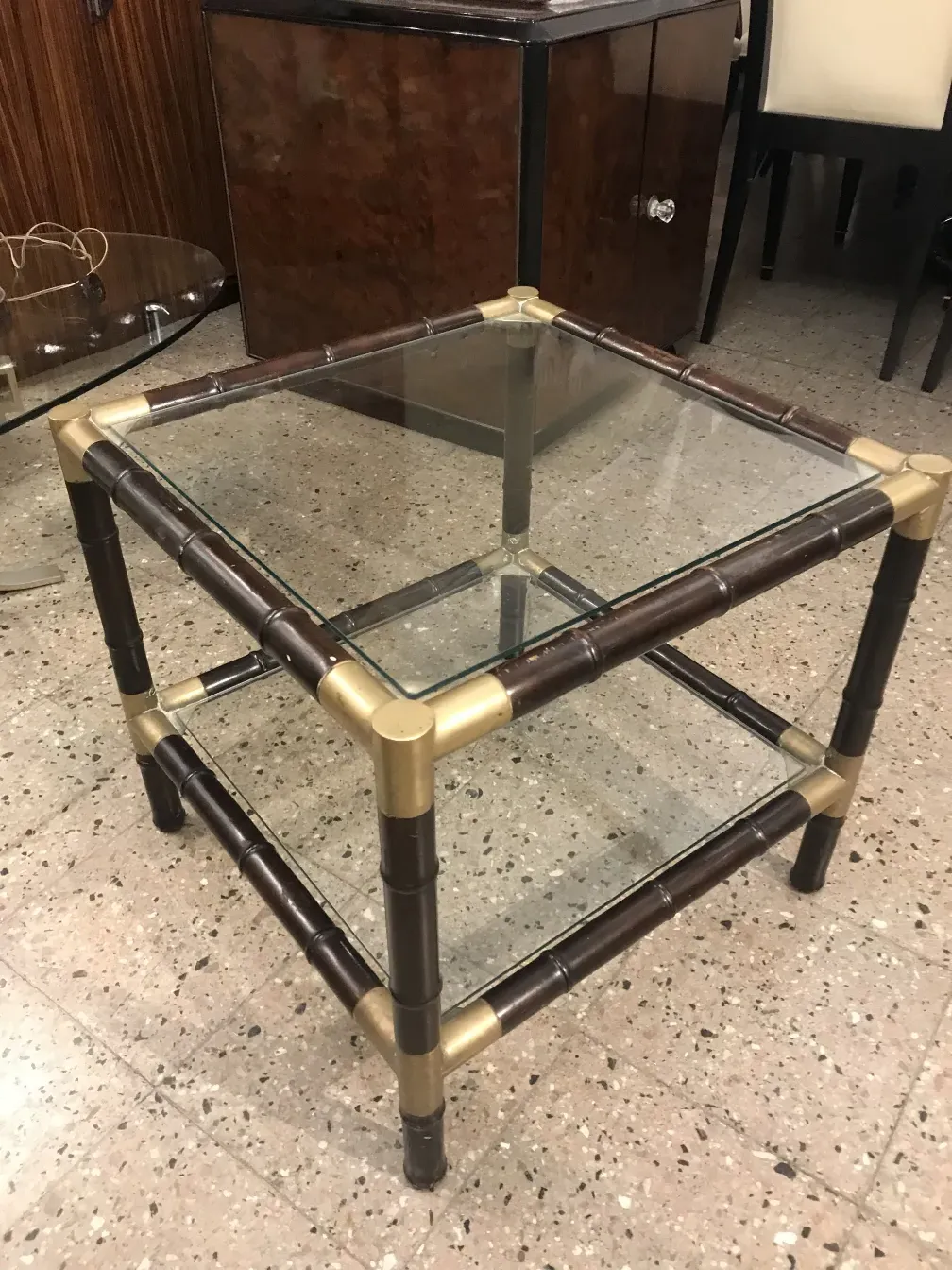 Antique coffee table with bamboo structure and glass, elegant setting