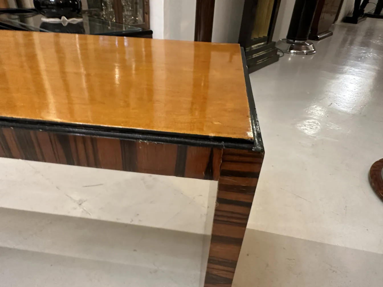 antique coffee table with a glossy finish and interesting details