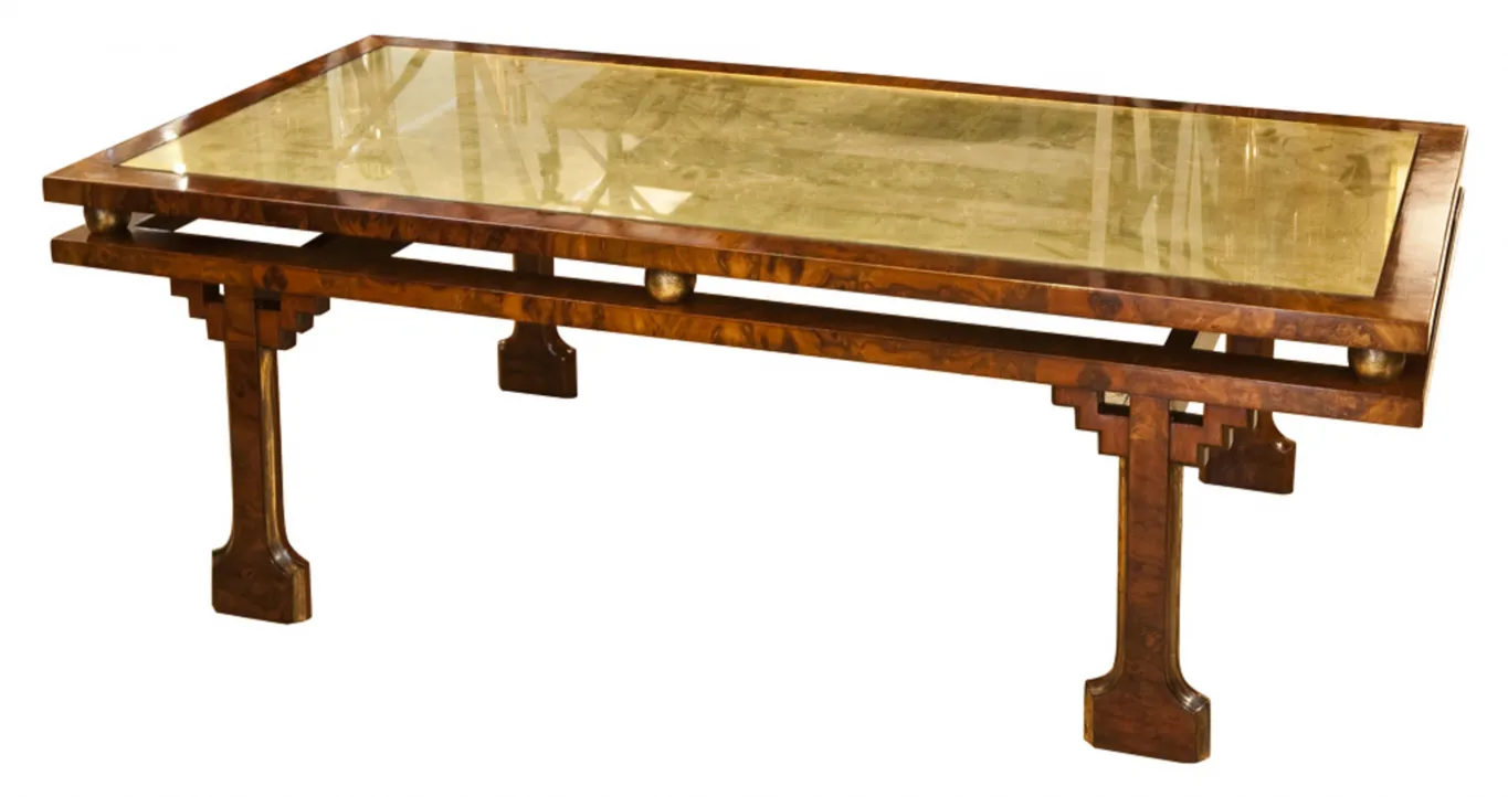 antique coffee table with shiny surfaces and decorative legs