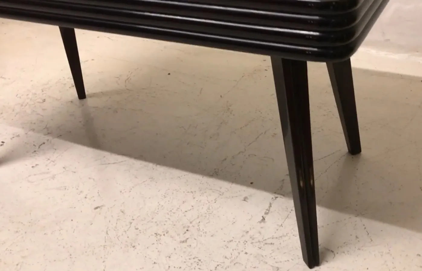 antique coffee table with graceful legs and appealing design