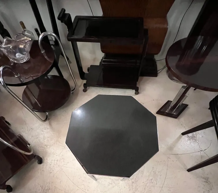 octagonal antique coffee table in an elegant setting with other furniture