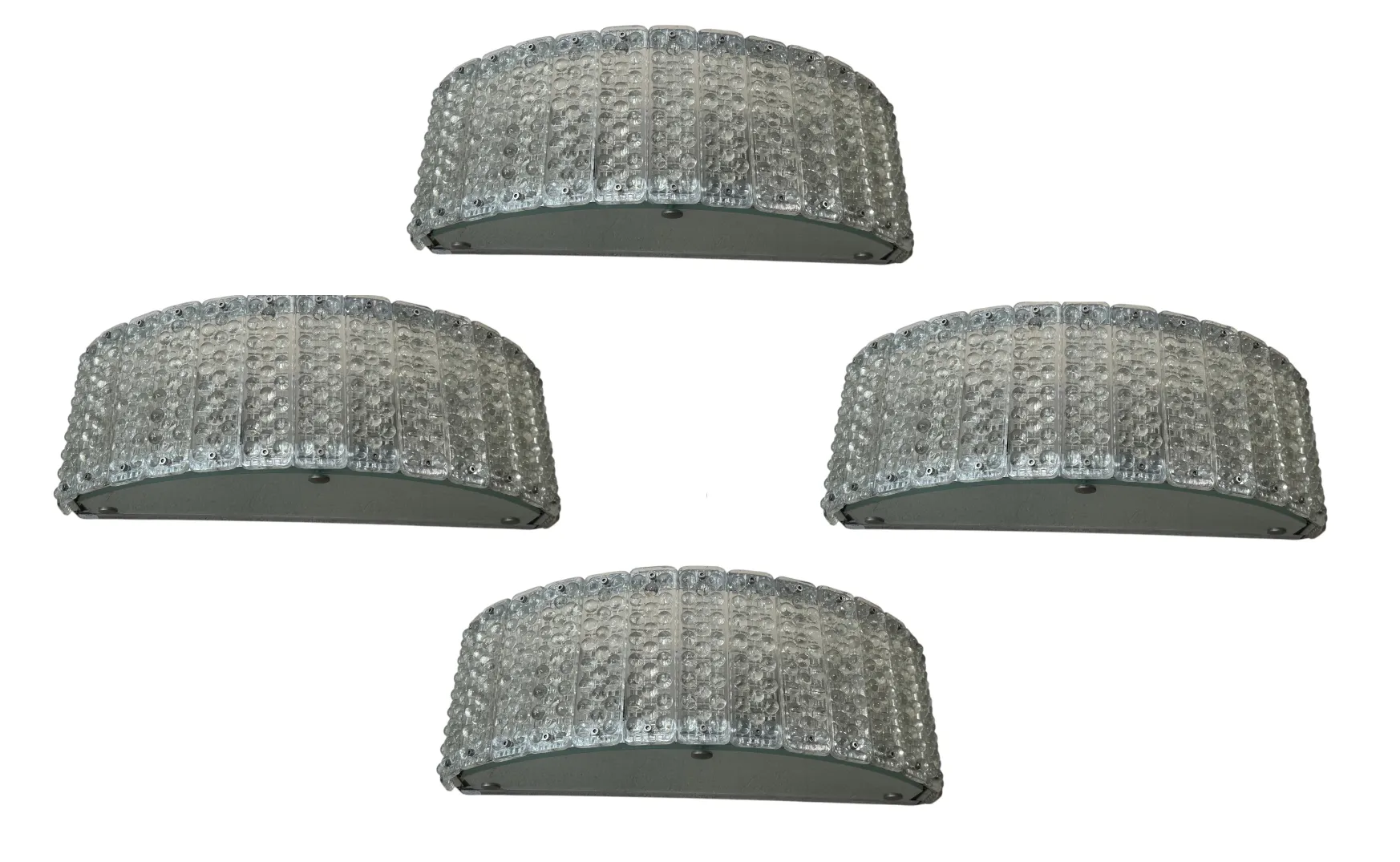 Four antique sconces from the 50s on a neutral background.