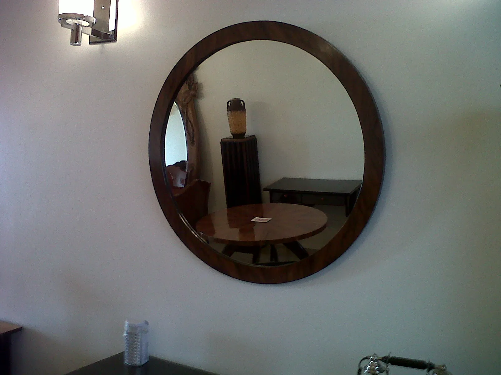 antique decorative round mirror in a room