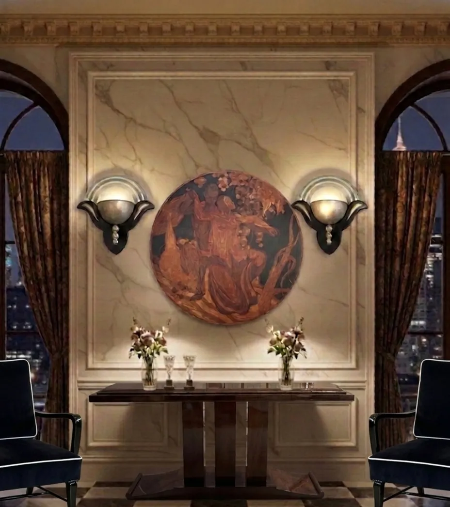 antique pair of sconces with elegant design on the wall