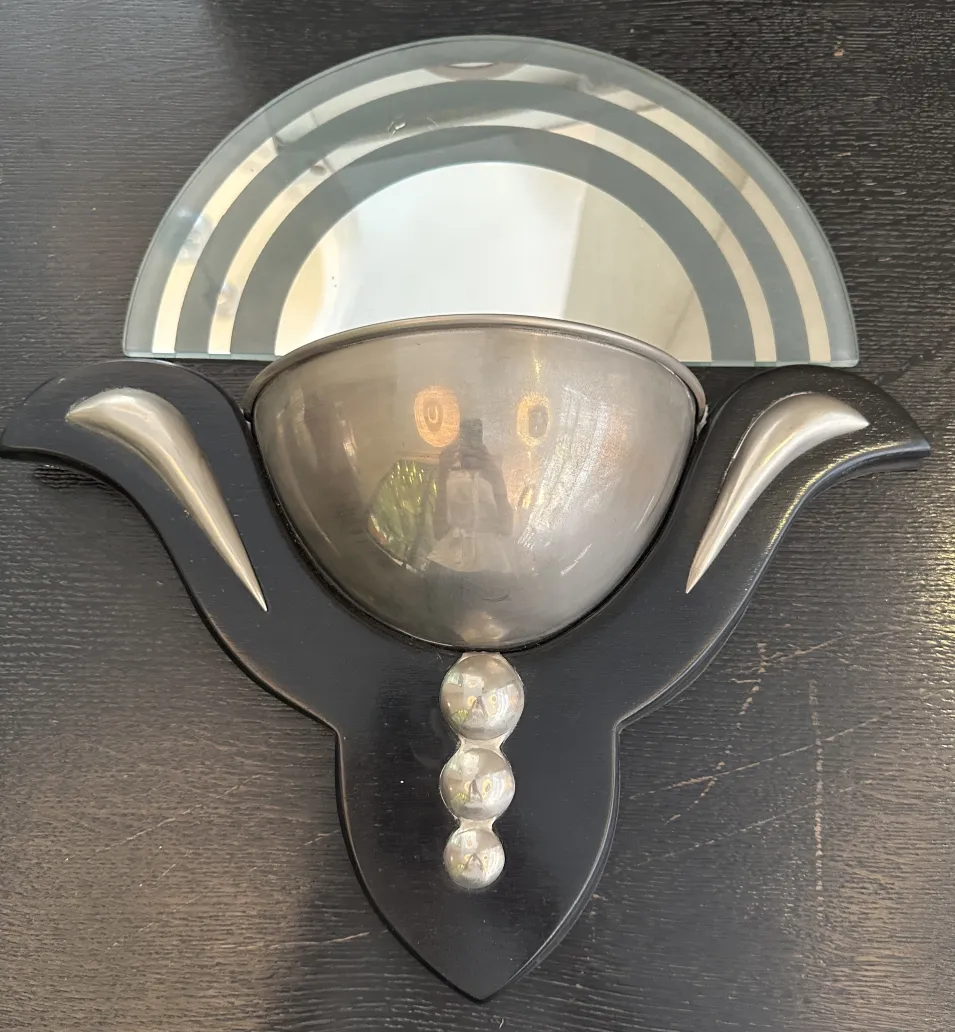 Antique pair of sconces in Art Deco style featuring elegant shapes and decorative details.