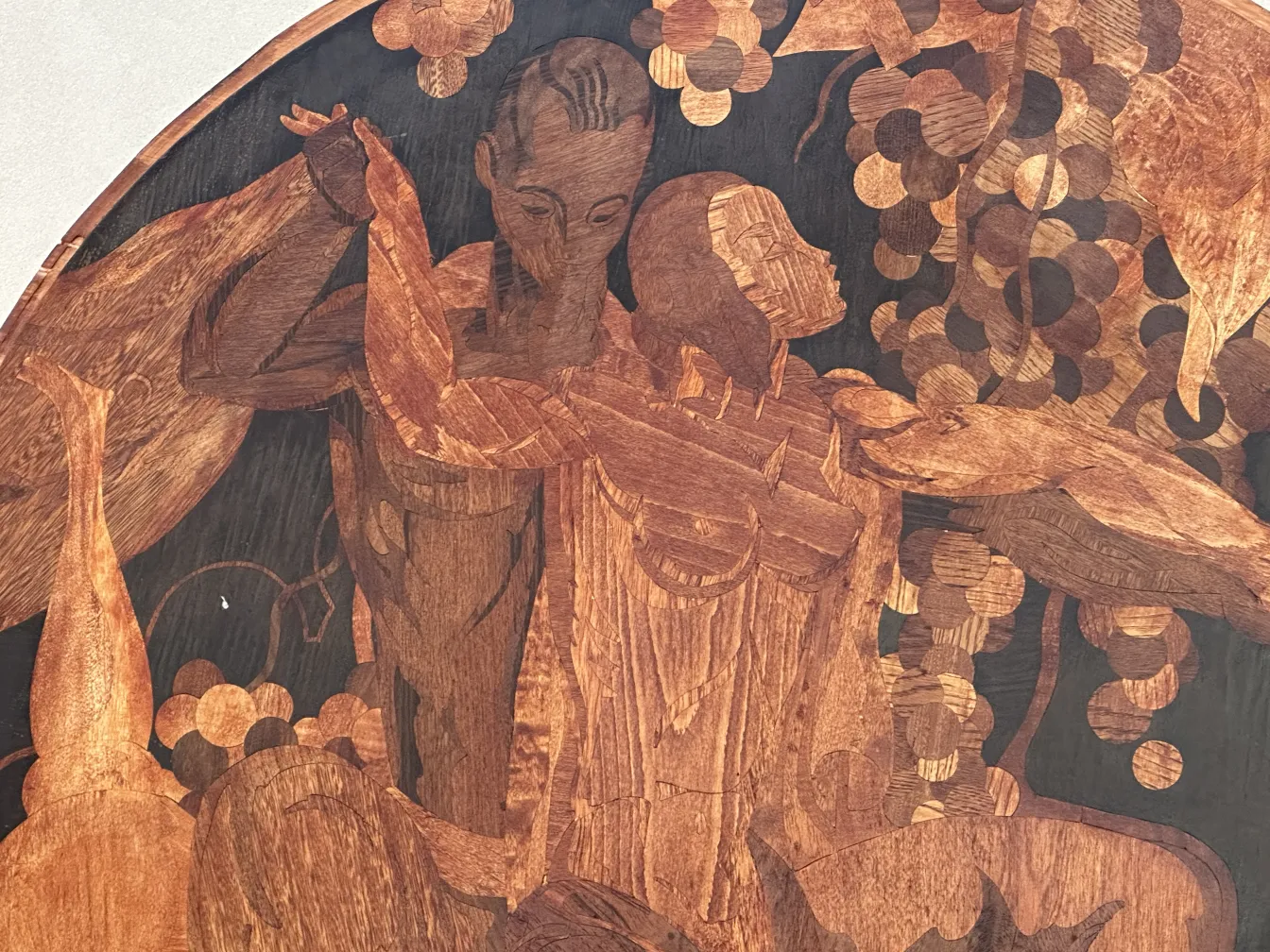 Antique marquetry featuring human figures in an organic design