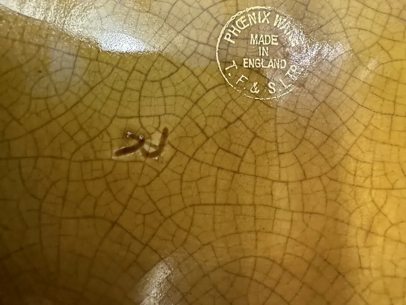 antique planter featuring a visible mark