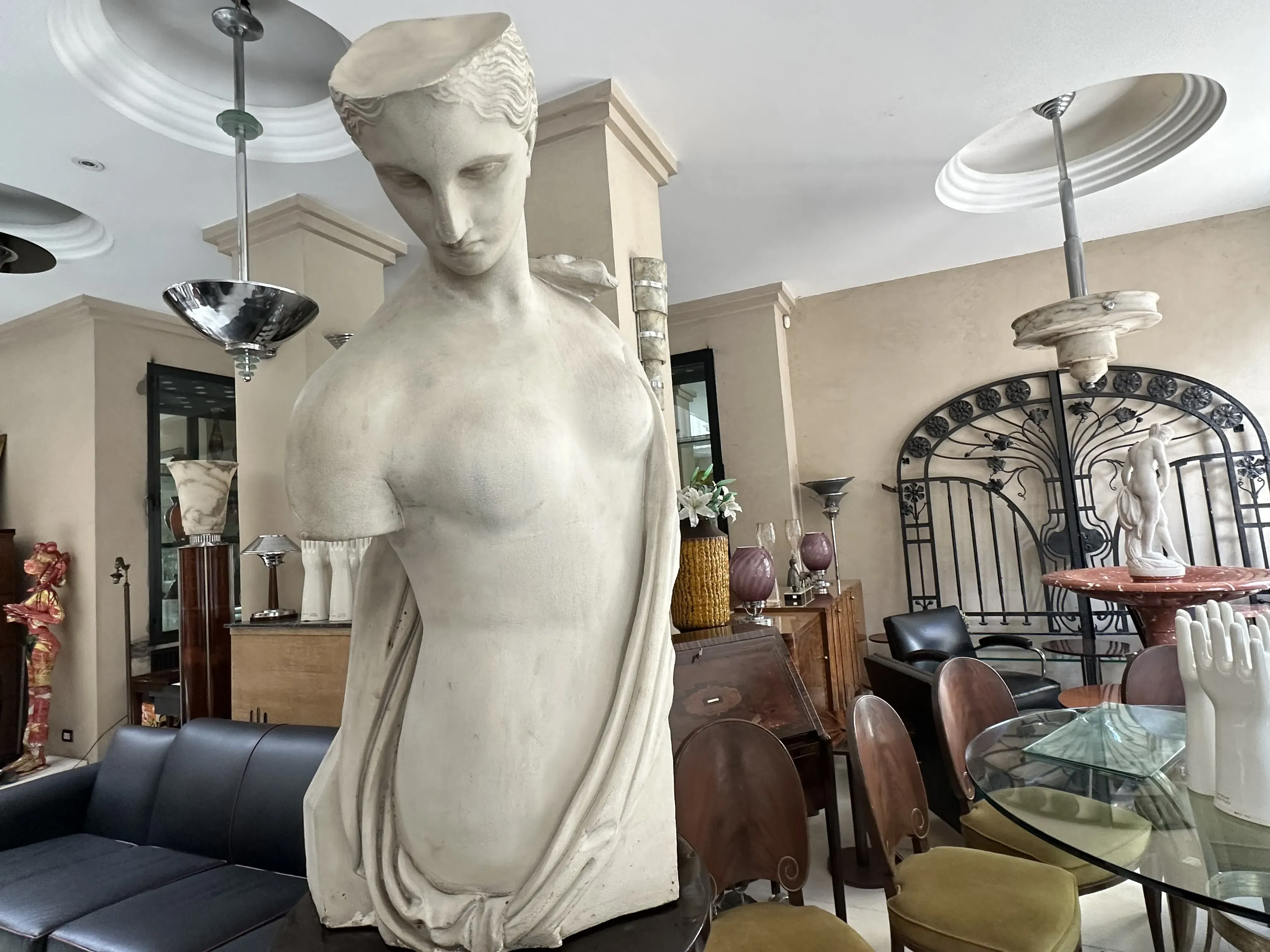 ancient sculpture by Pietro Barzanti in a modern room with elegant furniture and decorative elements