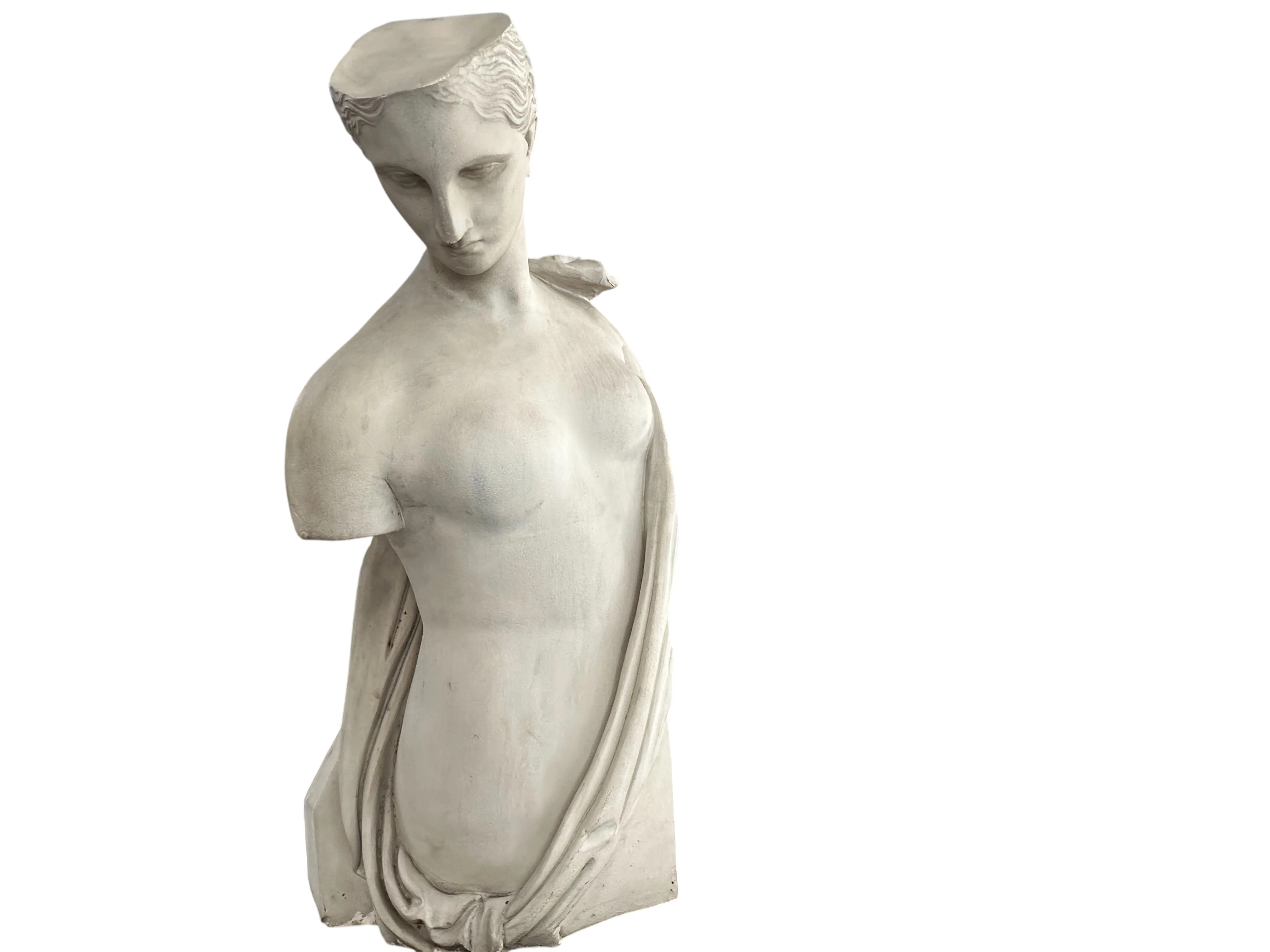 ancient sculpture of a female figure with drapery