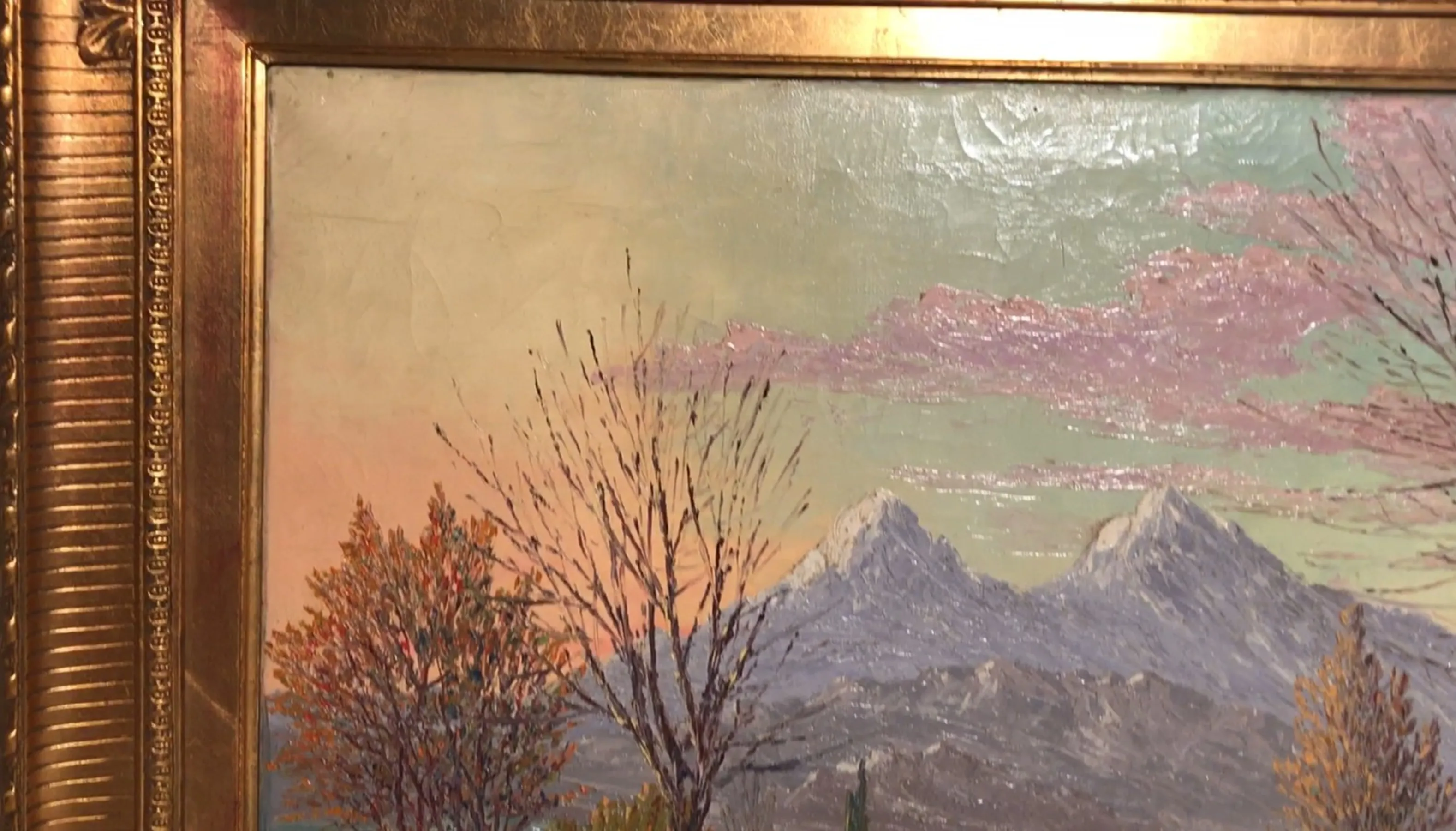 antique painting of a mountainous landscape at sunset with trees