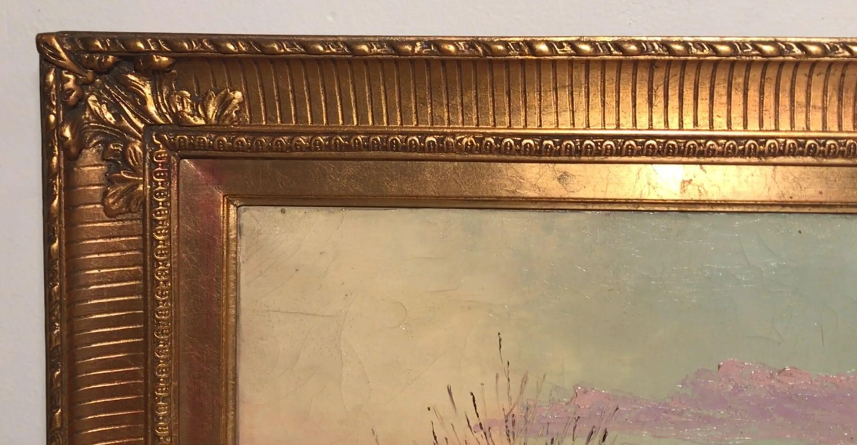 ancient painting in soft tones with a golden frame
