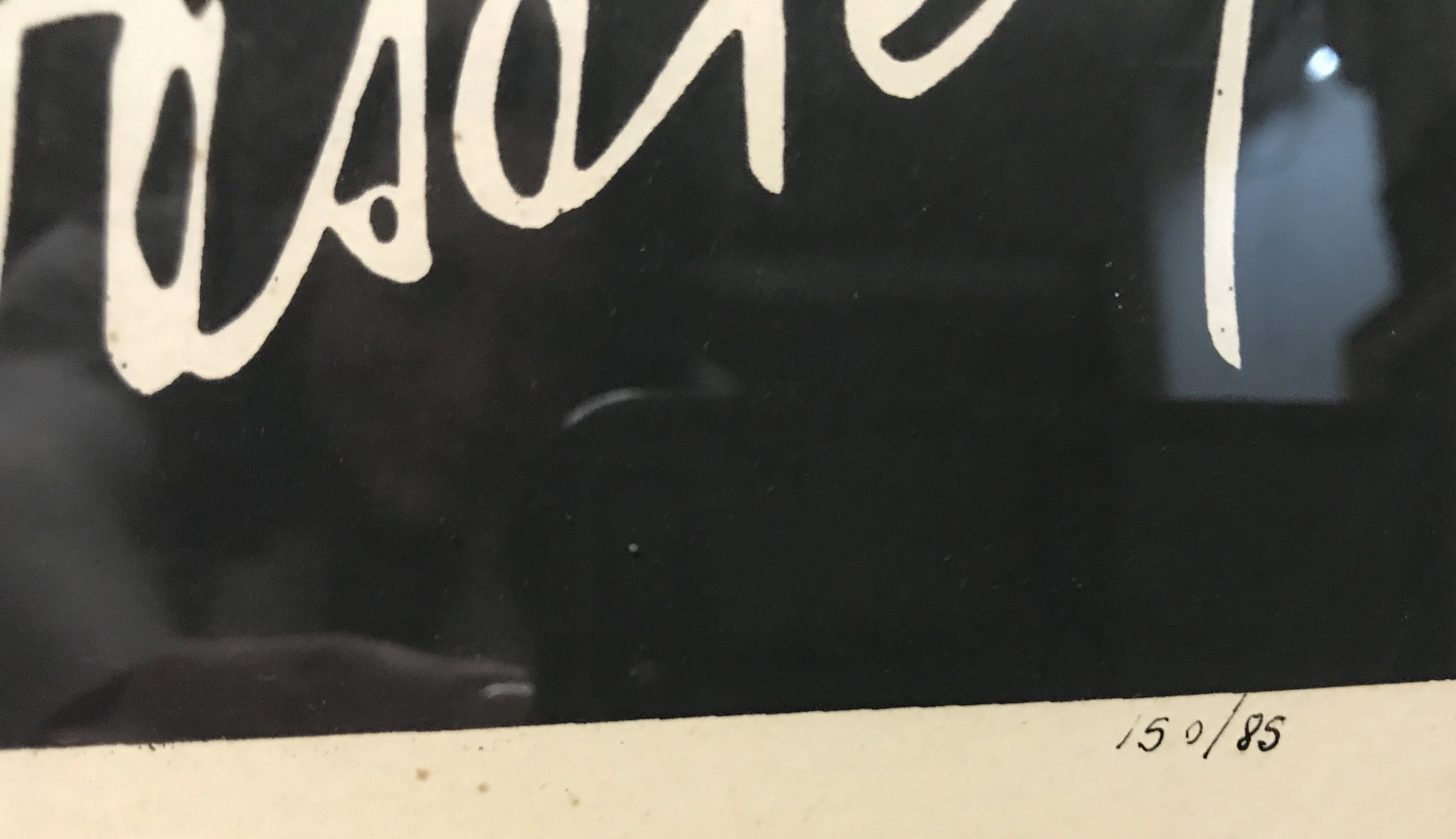 Foglio antico con numeri e firma visibili nell'angolo.