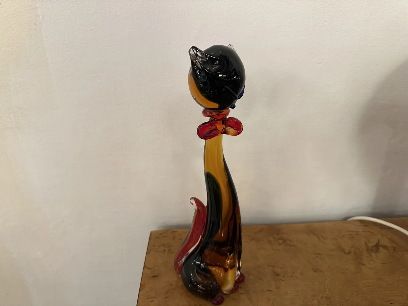 Antique Murano sculpture from 1950 showcasing vibrant colors and elegant shapes in a cozy setting.