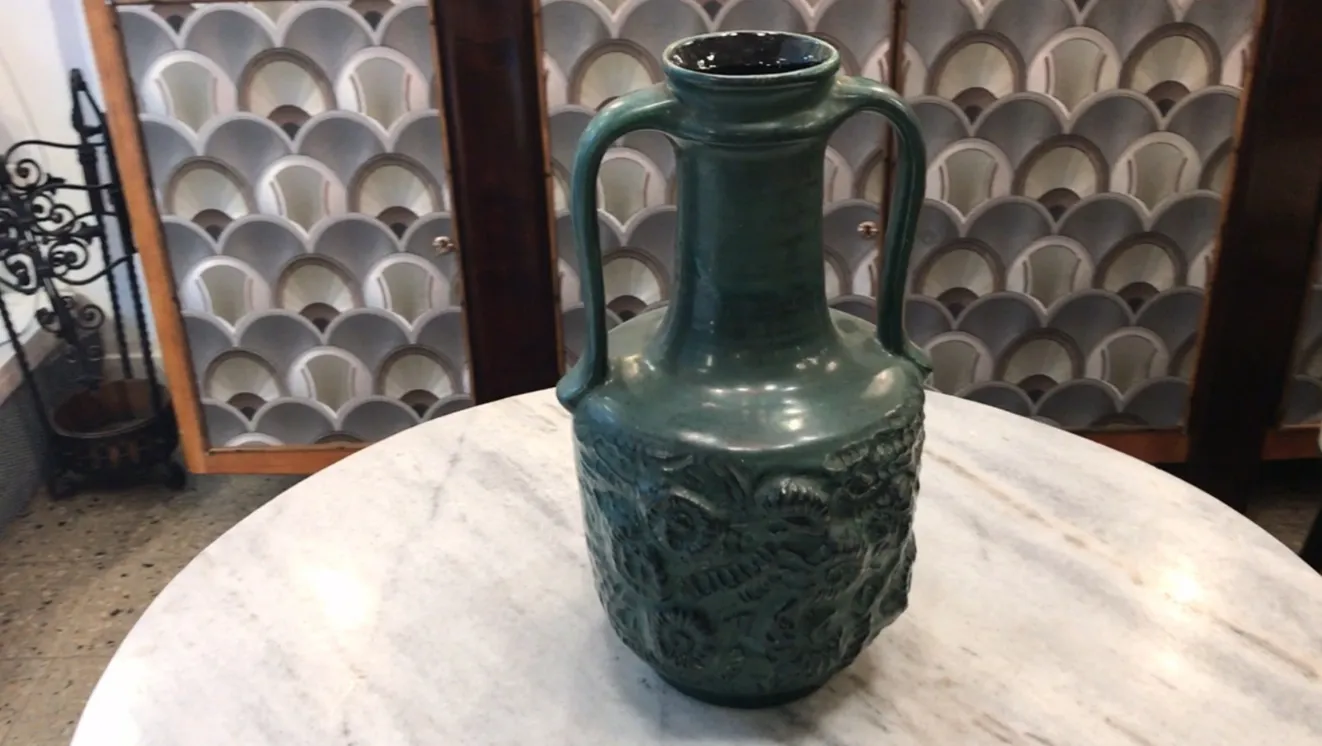antique decorative ceramic vase from Carstens Tönnieshof with intricate raised details, neutral background.