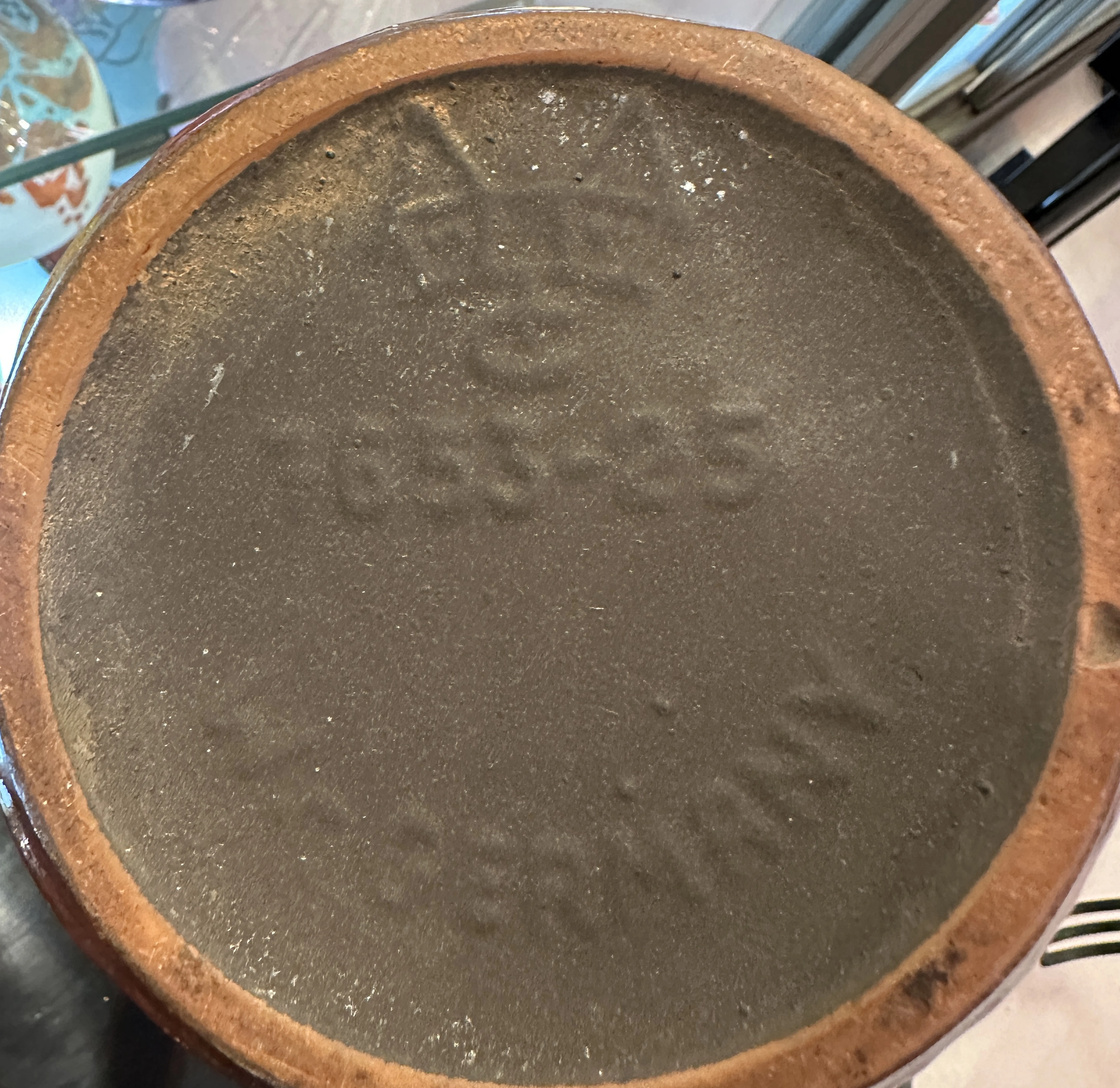 Base of antique ceramic with visible details.