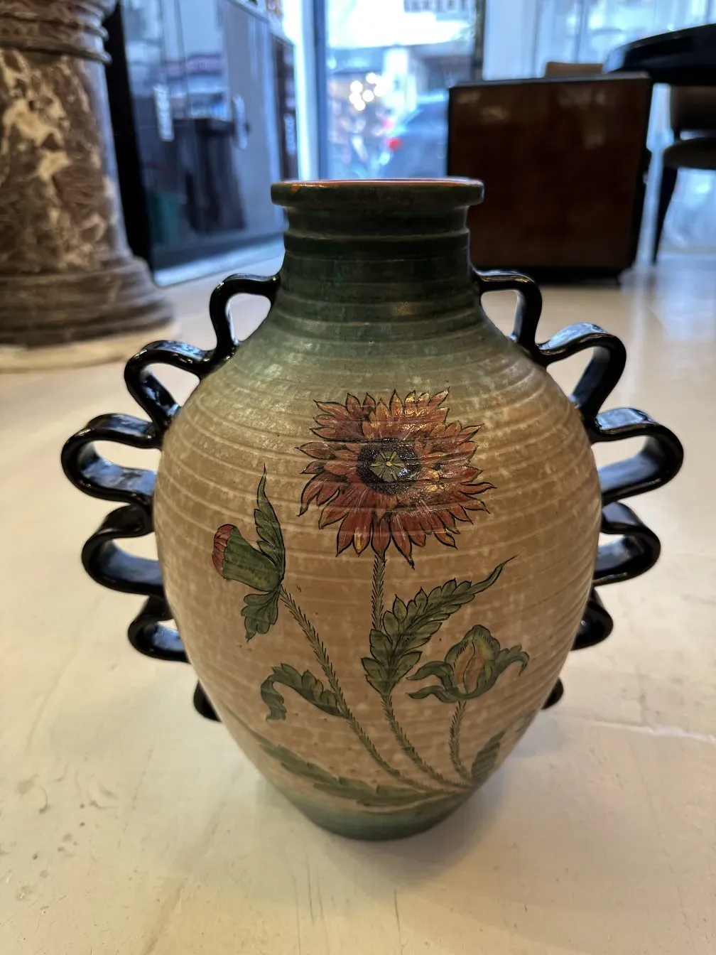 Antique Deruta ceramic vase with colorful floral design.