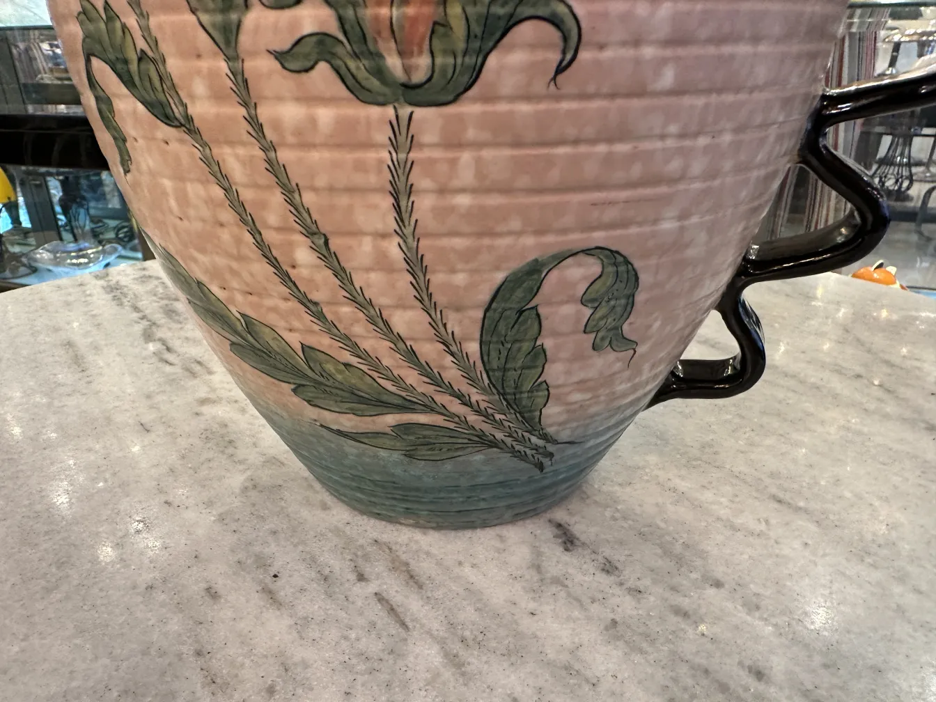 Antique Deruta ceramic vase with colorful floral design.