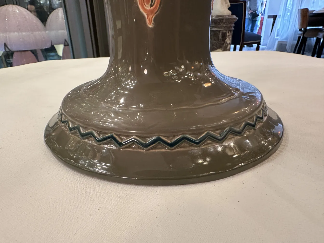 Base of antique ceramic by Eichwald with decorative details.