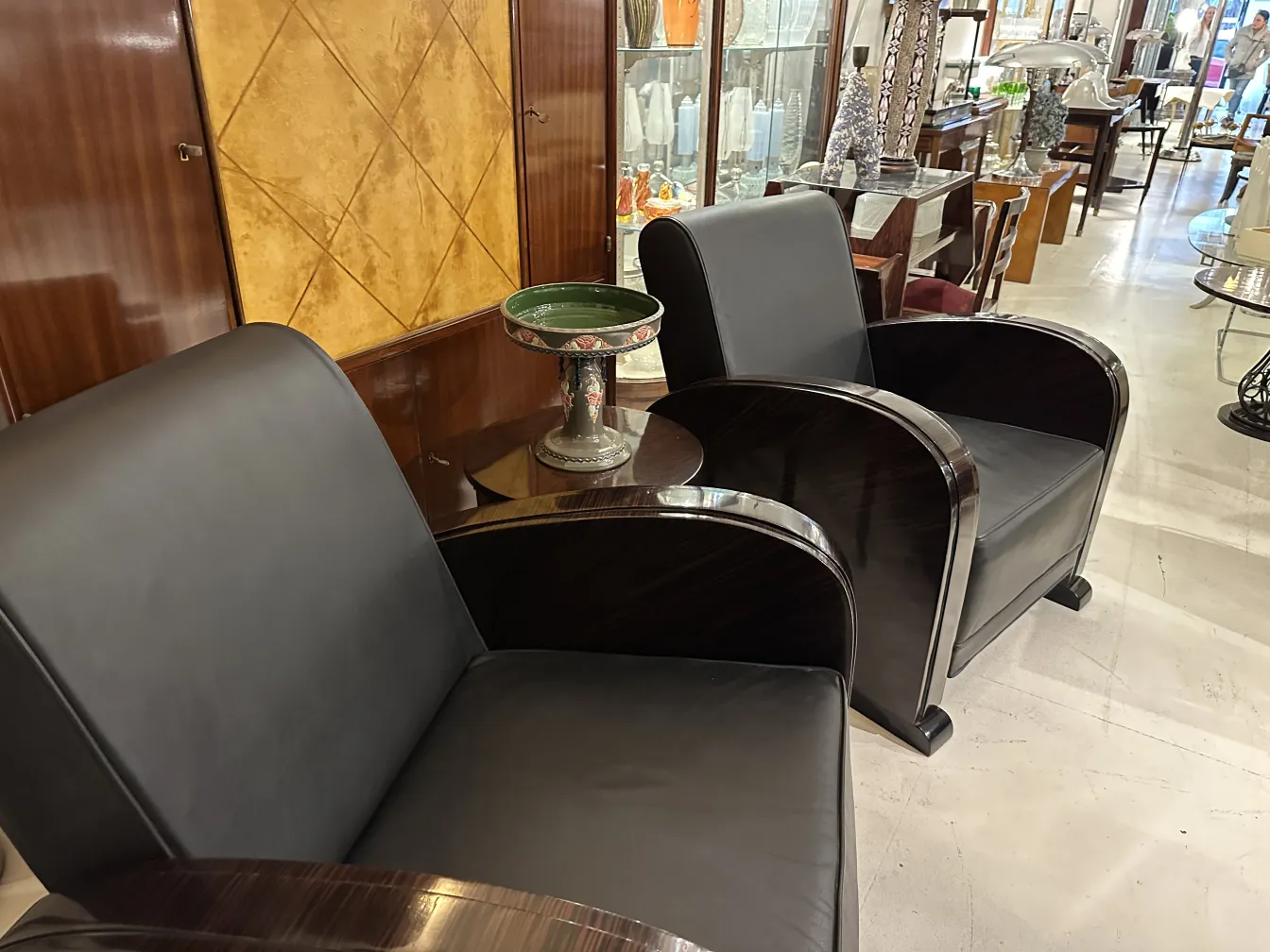 Antique chairs with Eichwald ceramic in the background
