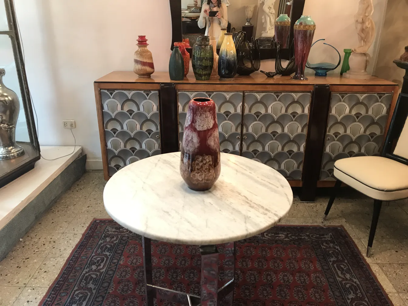 Antique ceramic vase on a marble table.