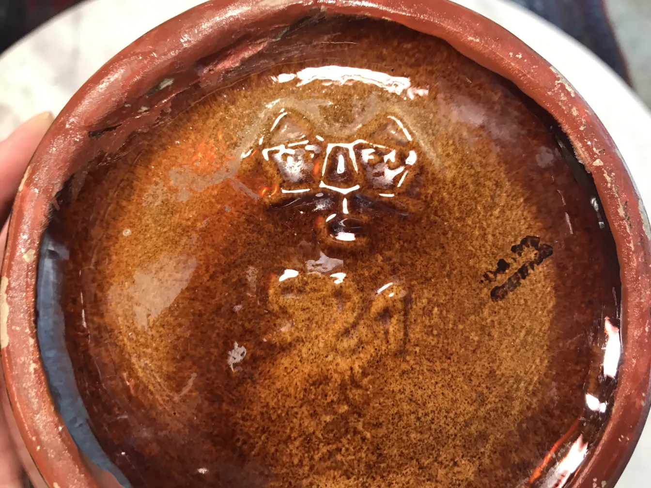 bowl of antique ceramic with shiny bottom and mark
