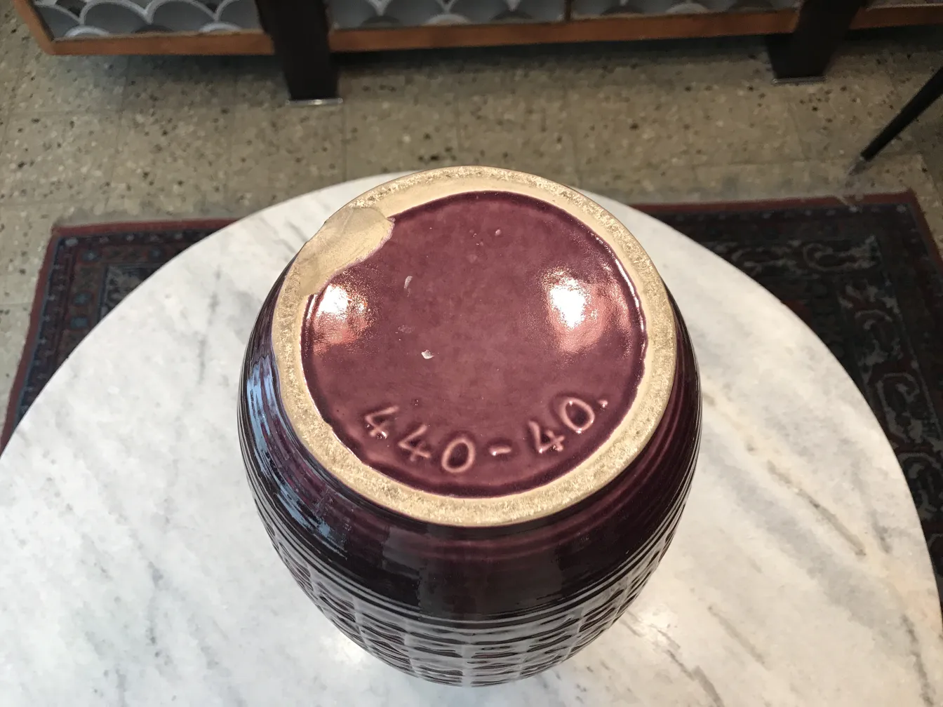 antique ceramic jug with purple decoration