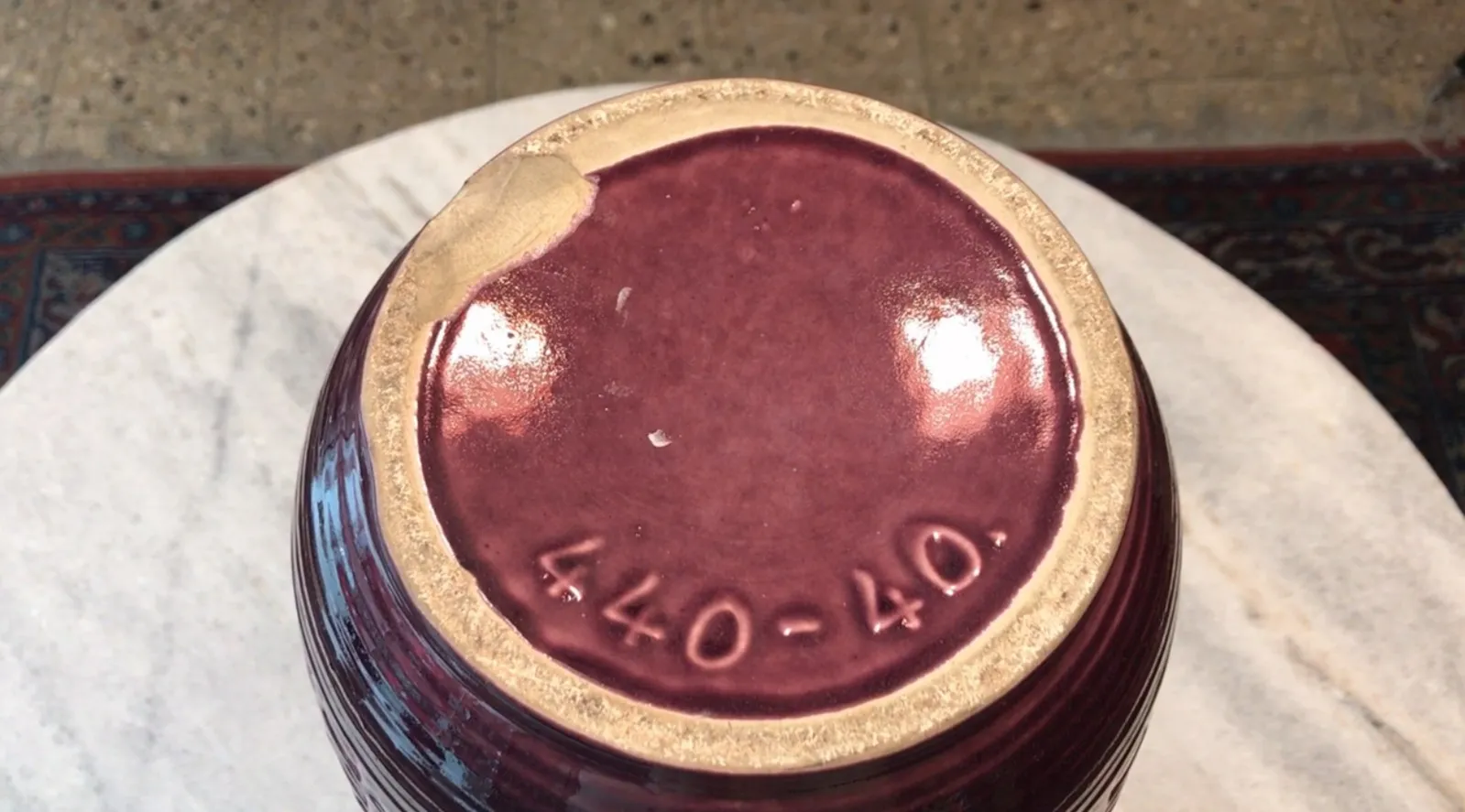 antique ceramic with purple details and round shape