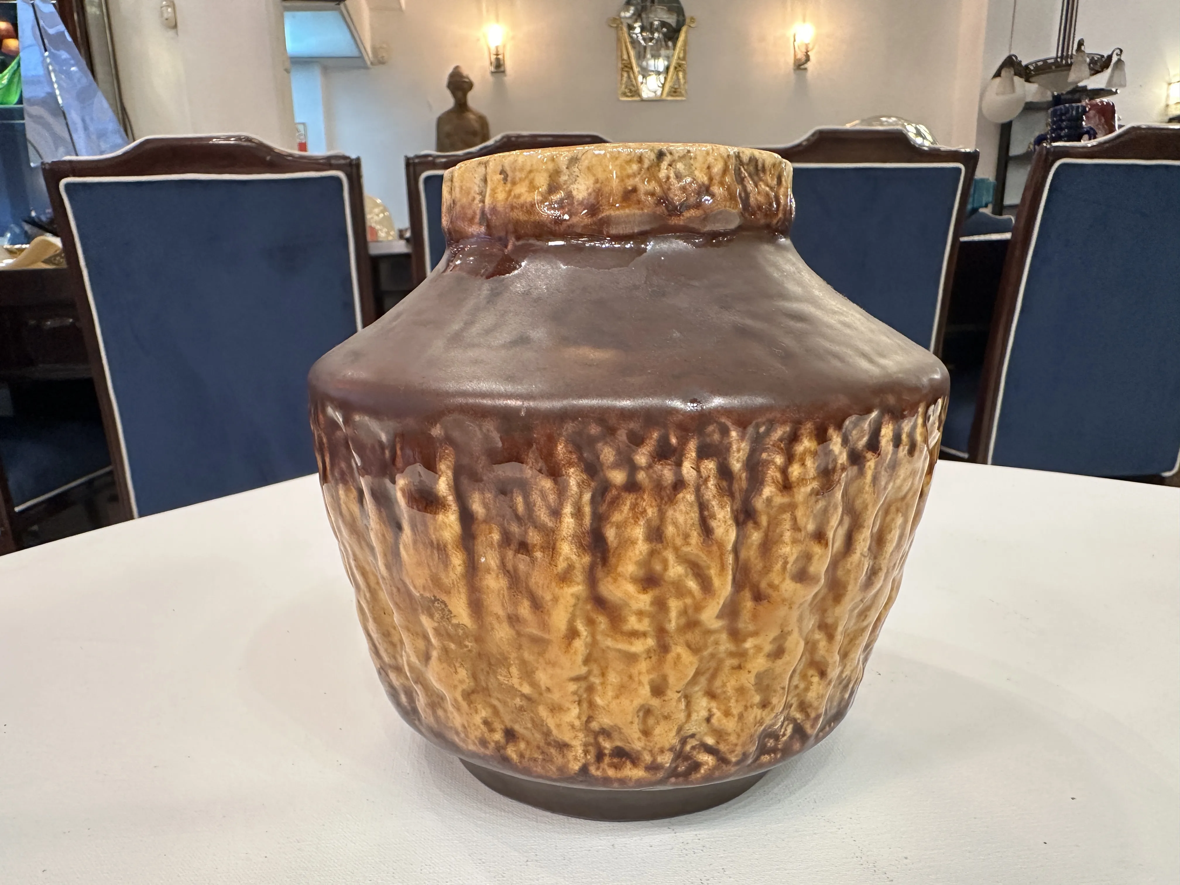 Antique ceramic vase with rustic texture, classic ambiance.