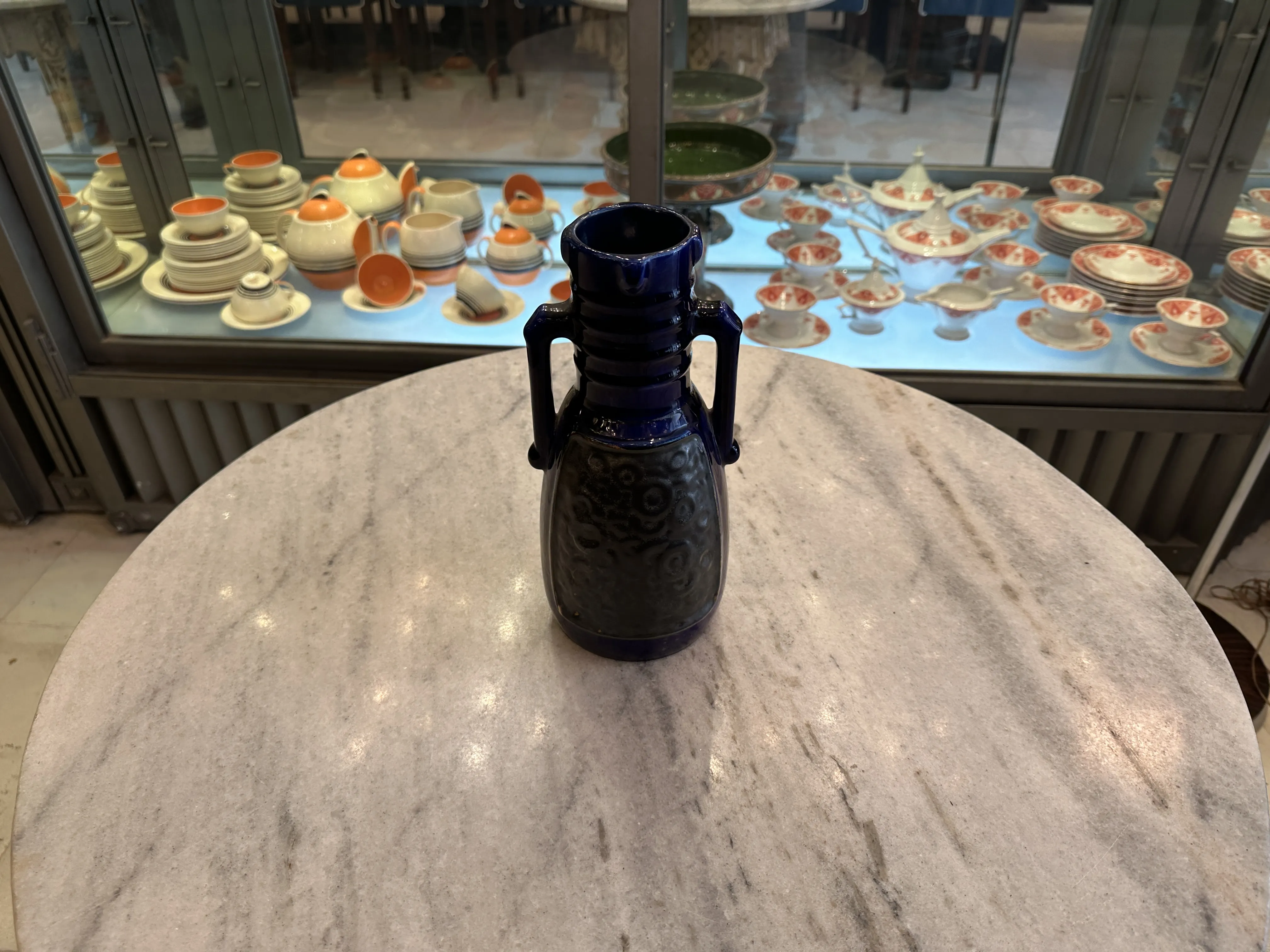 antique blue ceramic vase with relief design, antiquities display